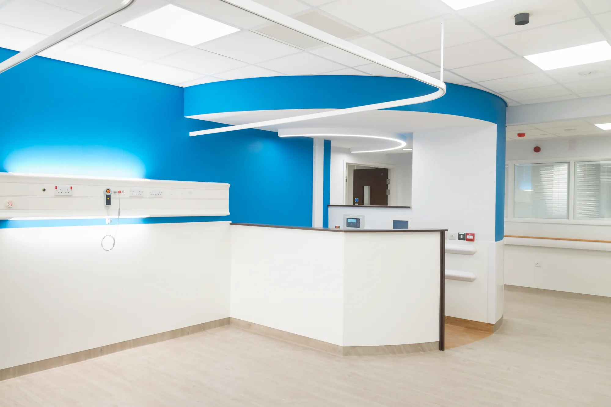 Jarvale-Construction-Frailty-Unit-Sheffield-14 Blue feature wall and nurse station in hospital ward