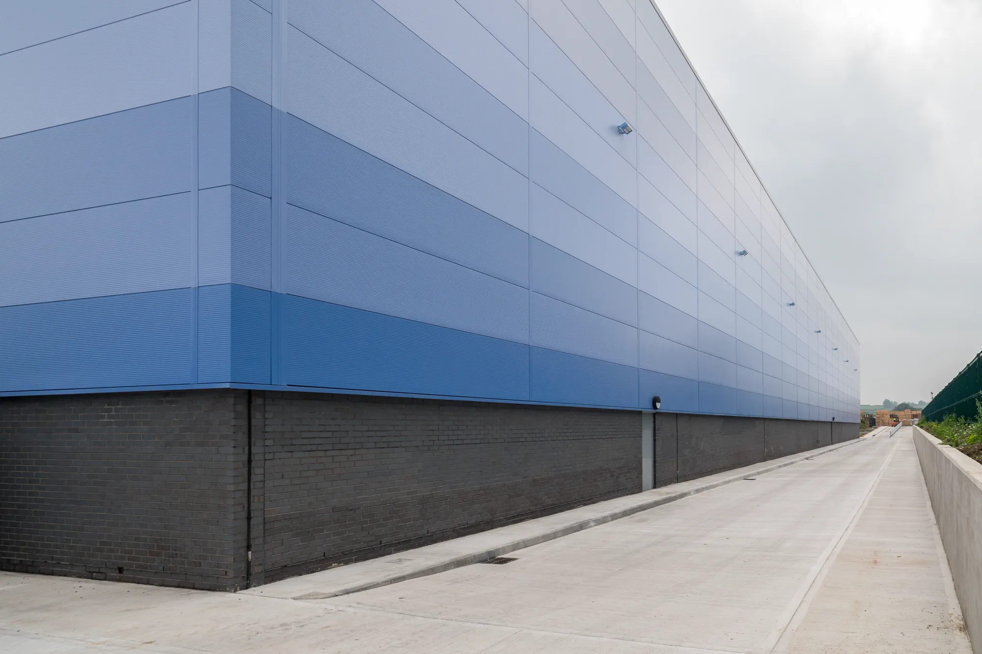 Warehouse elevation showing industrial cladding and access routes