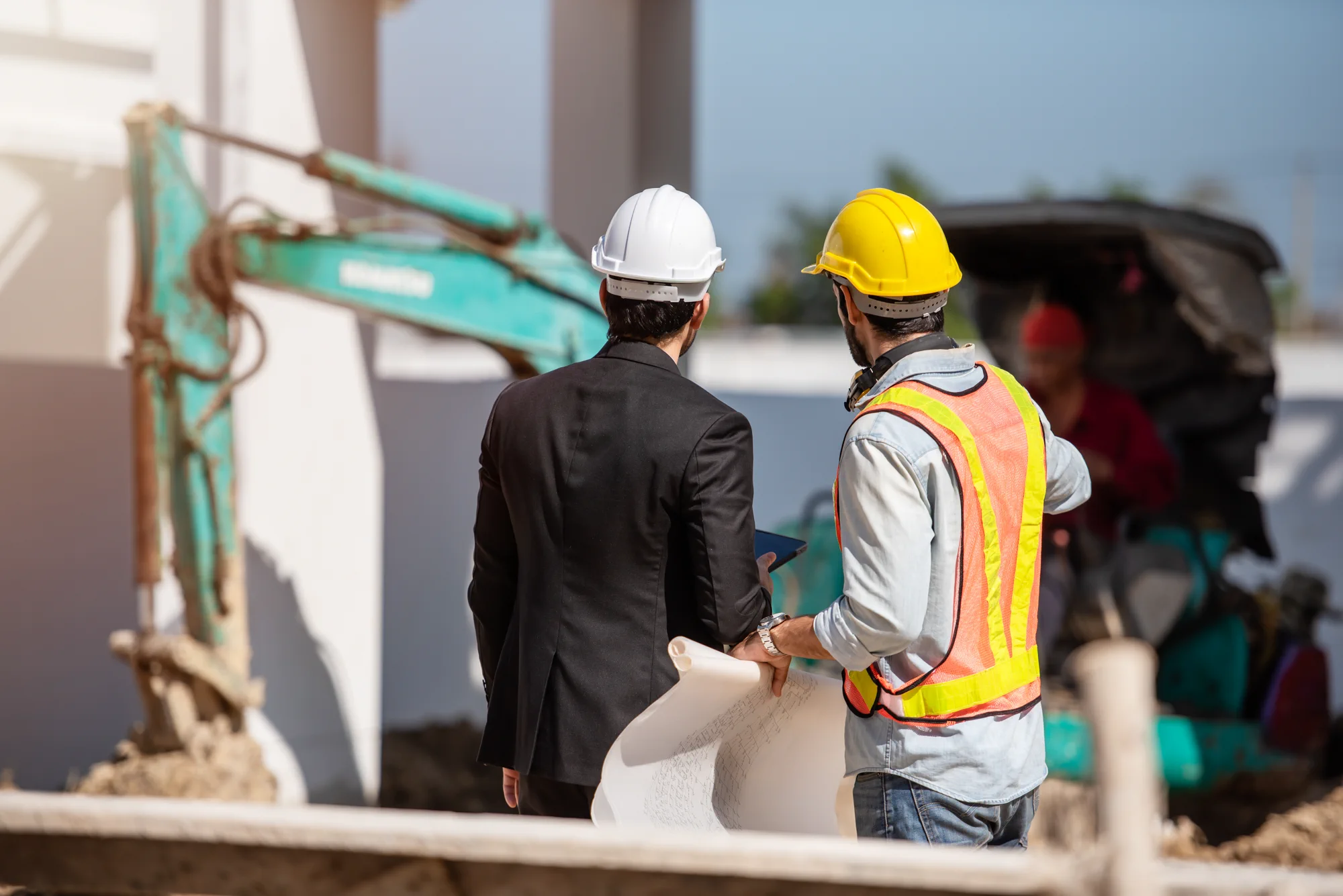 Jarvale-Construction-Retail-Construction-Services-4 Retail construction contractors reviewing plans on a commercial building project