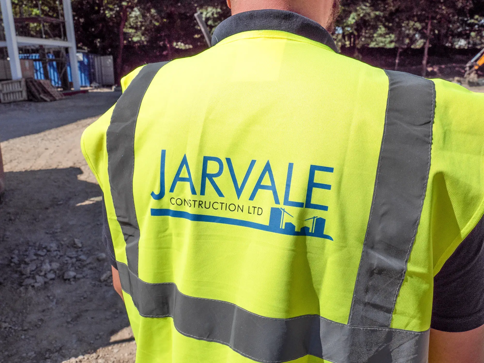 Jarvale-Construction-Specialists-Constractors-1 Jarvale Construction Ltd site operative wearing branded high-visibility safety clothing